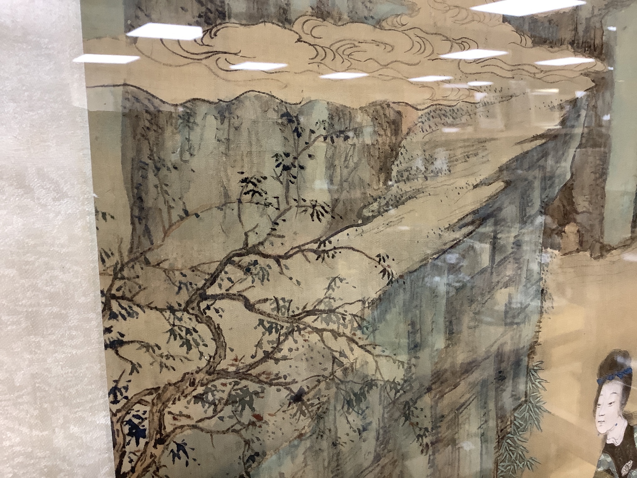 A large Chinese watercolour on silk, late 19th/early 20th century, woman in a landscape, signed, 91 x 42cm.
